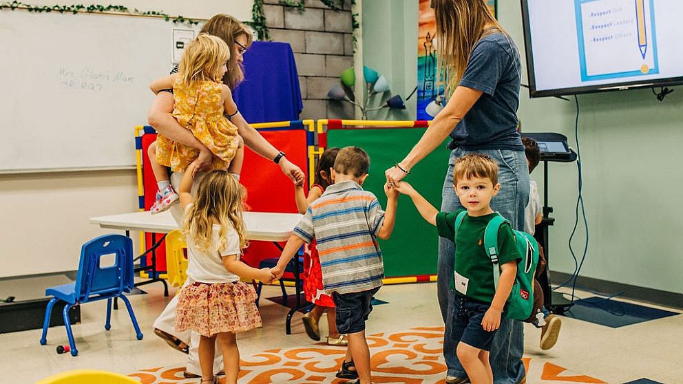 C3 kids holding hands